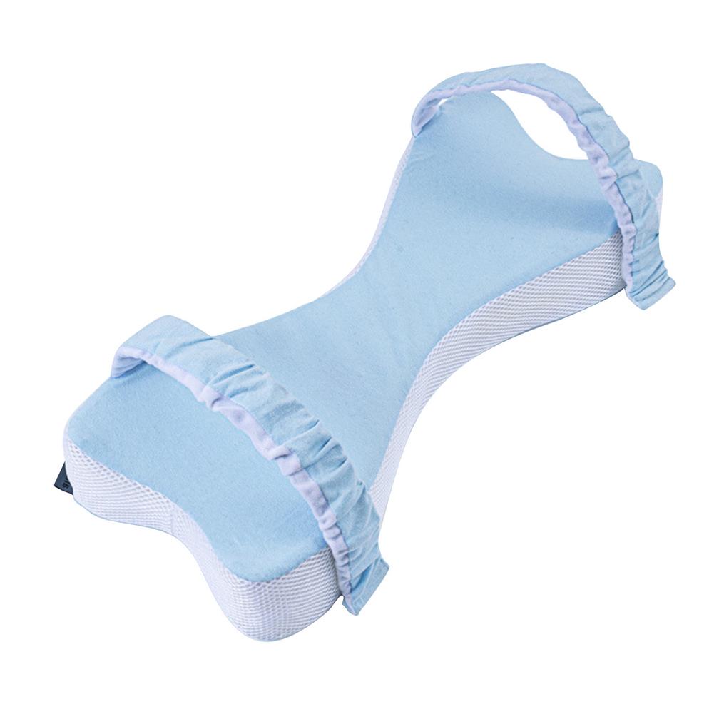 Blue leg pillow seen from above, showing the curved shape