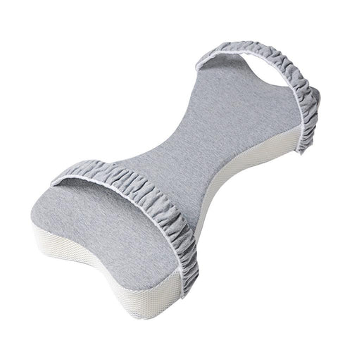 Grey leg pillow seen from above, showing the curved shape